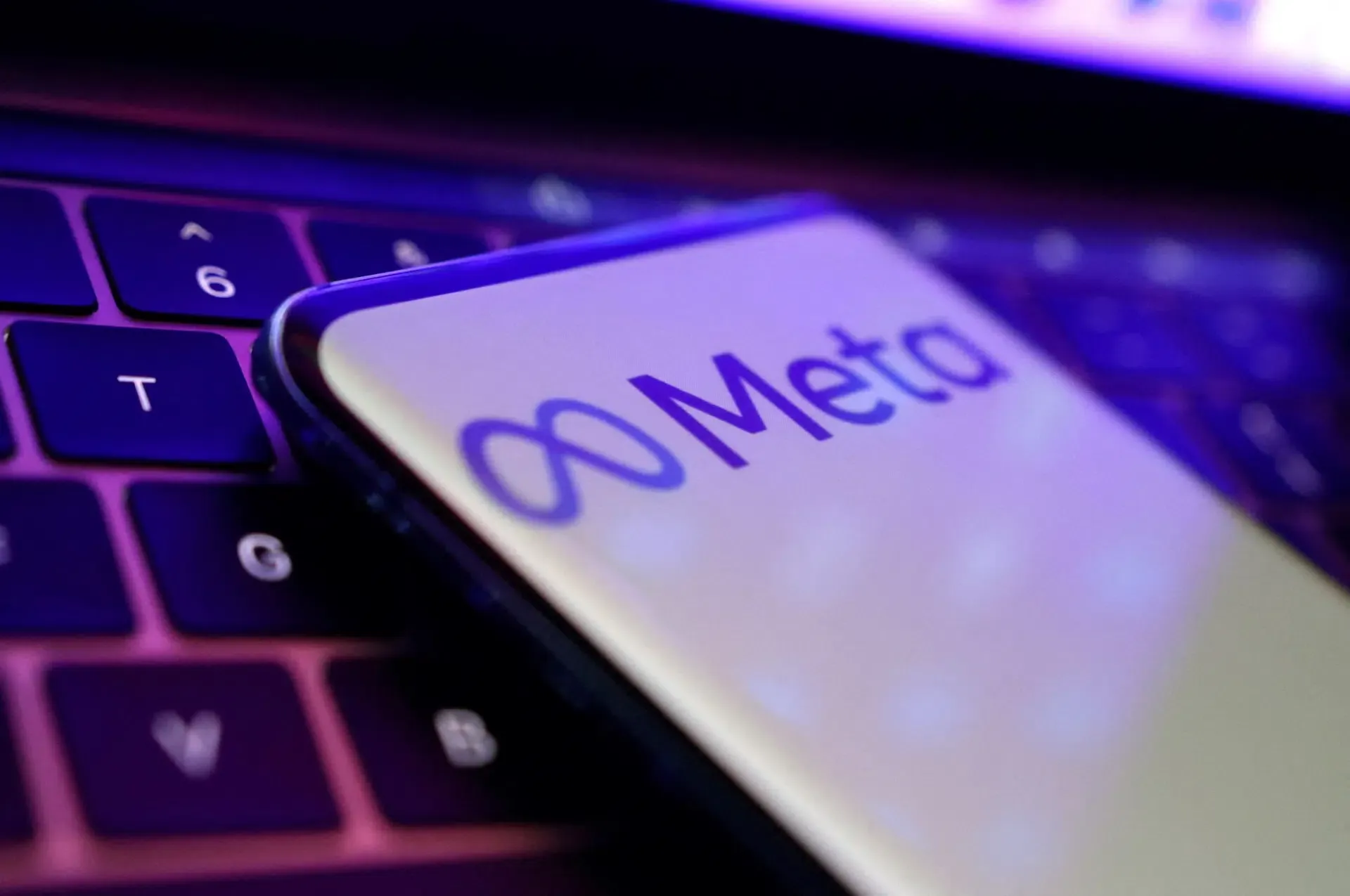 Meta corporate logo displayed in front of technological data visualization