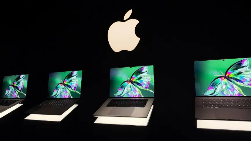 14-inch and 16-inch Apple MacBook Pro with PROLED XDR Display models tilted forward on a table during hands-on testing