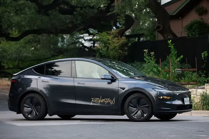 A Tesla Robotaxi branded Model Y operating in Austin as part of the initial pilot fleet