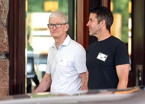 Tim Cook and incoming Apple CEO John Ternus walking together at the Sun Valley Conference