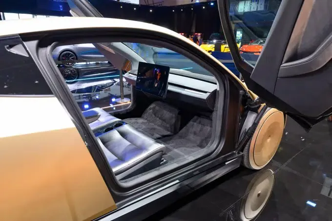 Minimalist interior of the Tesla Cybercab highlighting the central touchscreen with no steering wheel or pedals